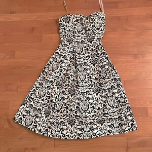 Black and  white strapless tea length dress